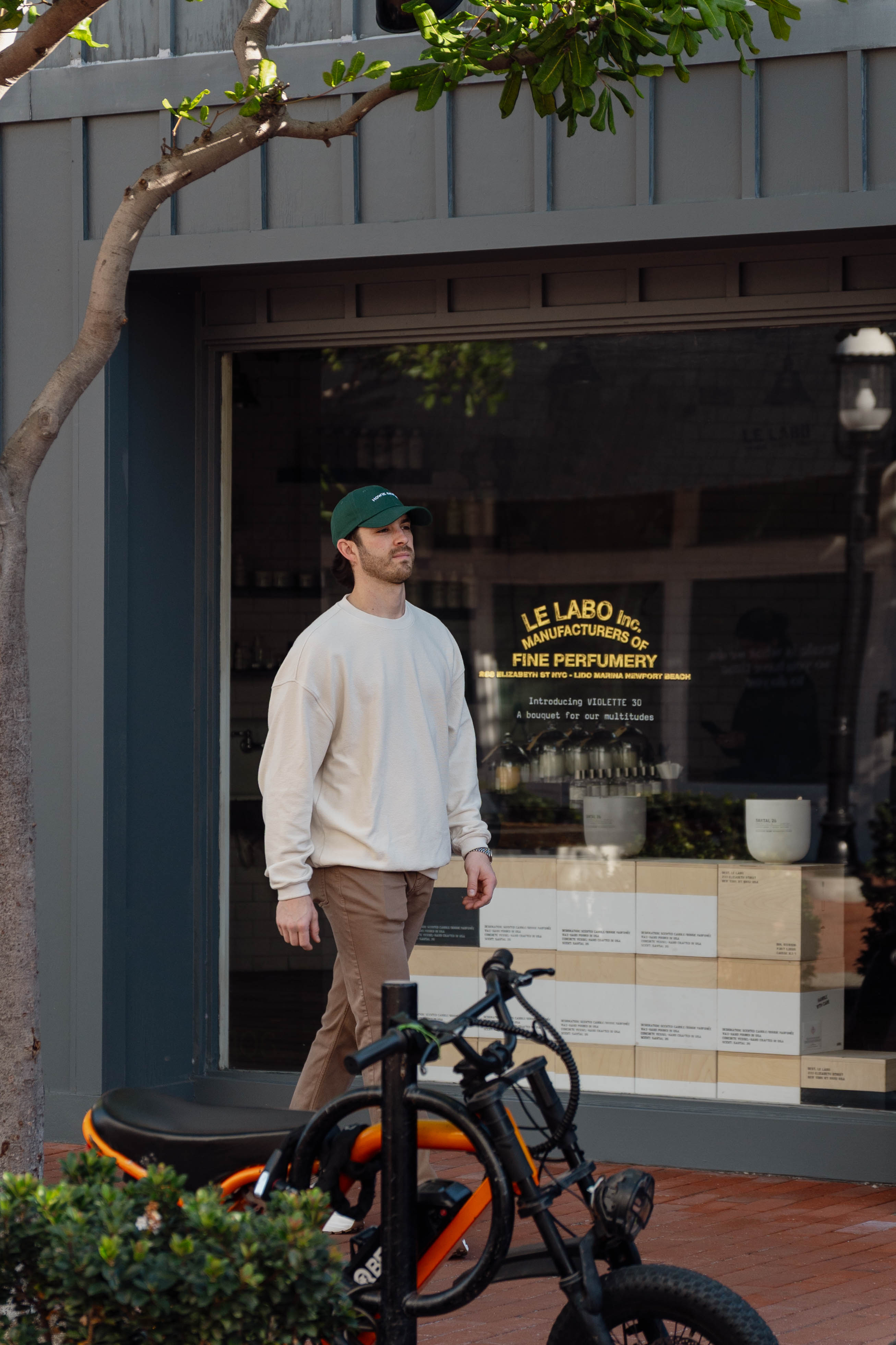 Man walking past a store with bicycles in front
