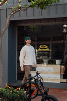 Man walking past a store with bicycles in front